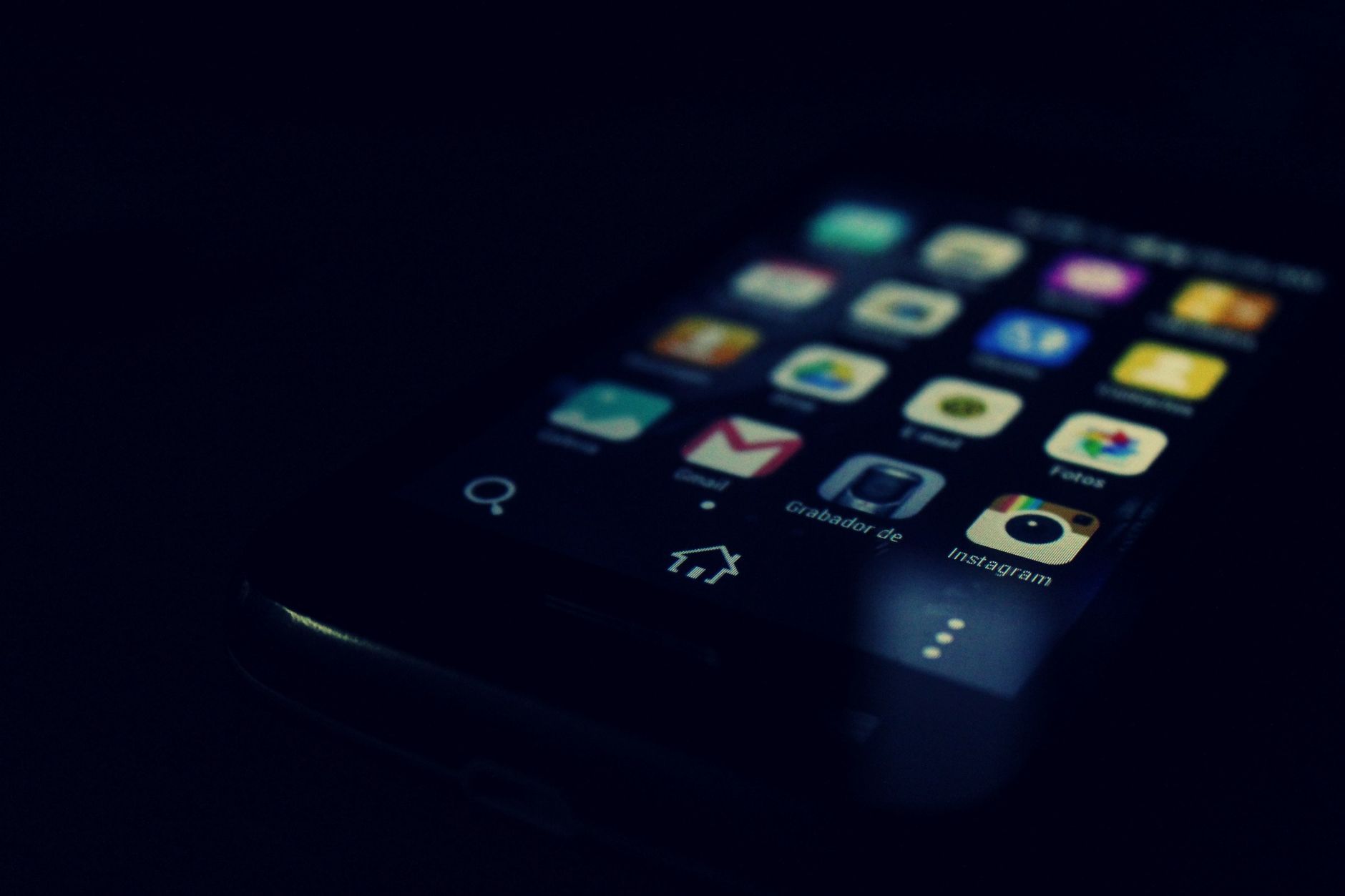 Small business owner reviewing an app design on a phone